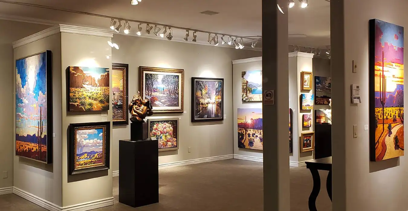 Interior of Pejman Gallery showing classic sculpture and traditional paintings.